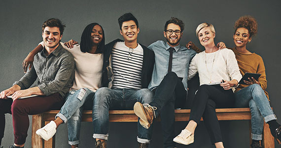 Young adults sitting on bench