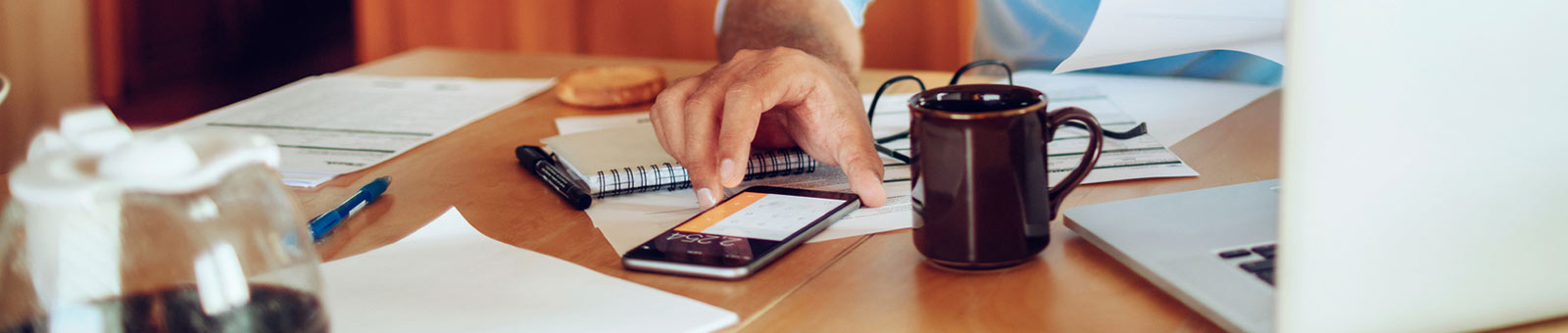 Man using calculator on phone