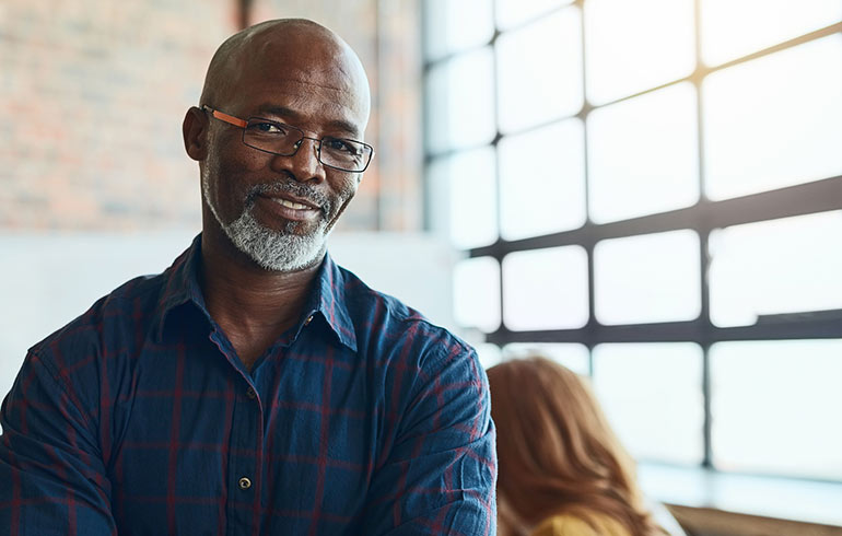 Man smiling in office