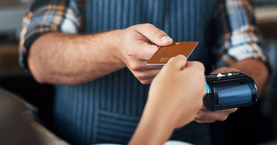 Handing credit card to barista